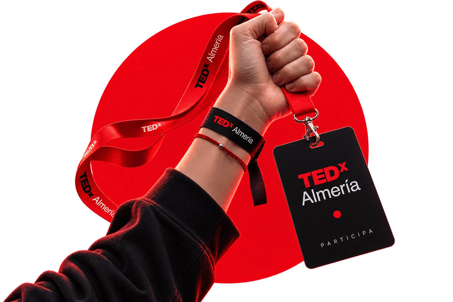Mano alzando una acreditación de TEDxAlmería